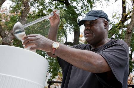 Vaughn McLamb, with Graffiti Church on Manhattan's Lower East Side, ladles steaming cups of chicken soup for the crowd gathered at Tompkins Square Park. McLamb found Graffiti when he was a drug addict living on the streets.  Photo by Peter Field Peck.