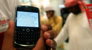 In this photo taken Thursday, Aug. 5, 2010, a BlackBerry user displays a text message sent by his service provider notifying him of the suspension of services, at a mobile shop in Dubai, United Arab Emirates. Saudi and Emirati authorities' battle with BlackBerry manufacturer Research in Motion shows how rapid changes in technology are sowing unease in countries where the unfettered flow of data is seen as a threat. Where the conservative Gulf states see security risks, critics find a convenient justification to further limit what information gets consumed and shared. (AP Images)